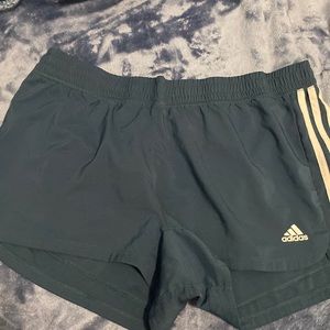 Green adidas shorts